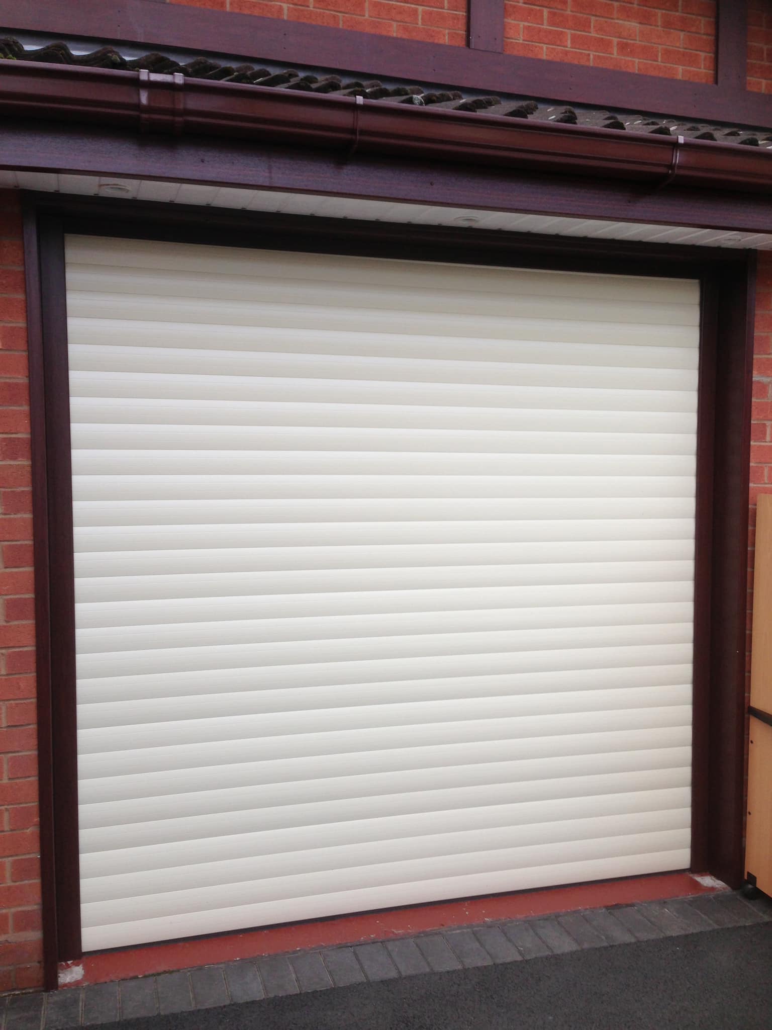 white automatic roller shutter garage door