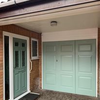 green matching front door and garage door