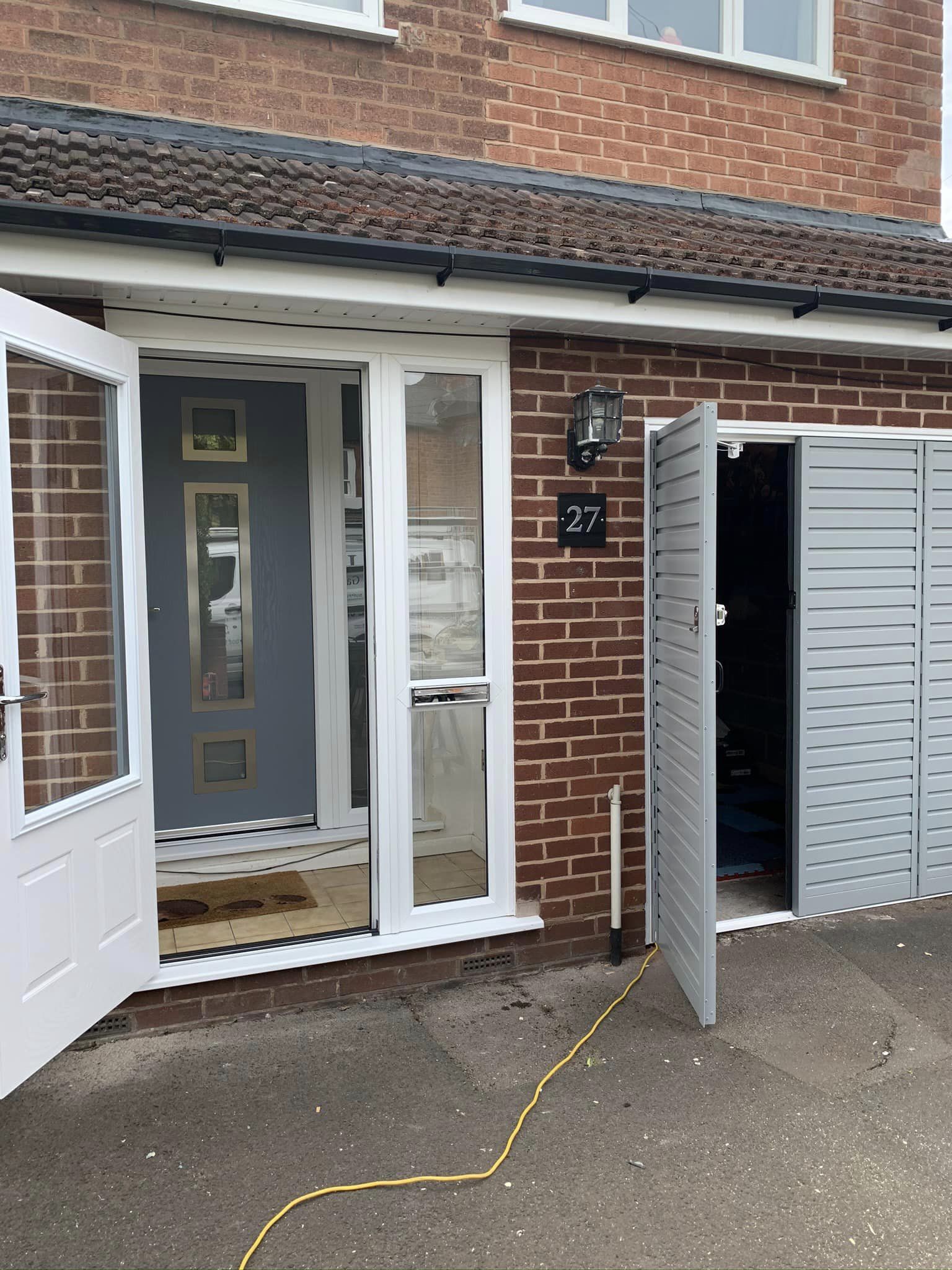 side hinged garage door light grey with new composite front door